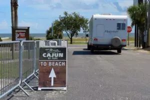 sign on a road saying "To Cajun Beach"